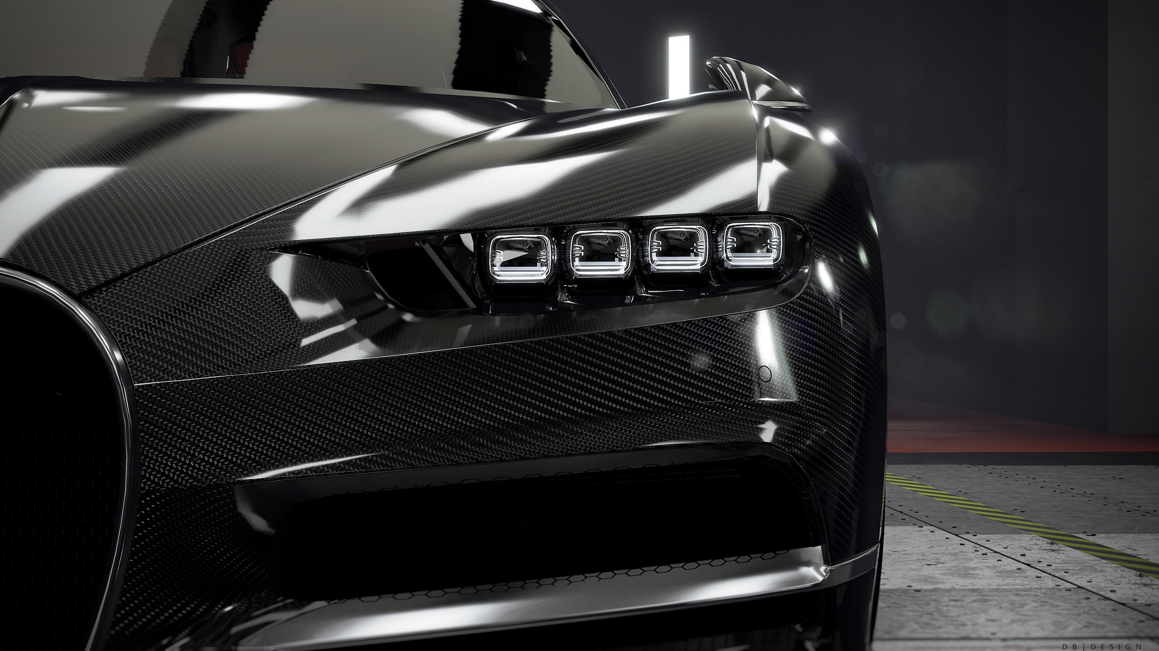 Close-up of a black car's front grille with a blurred background